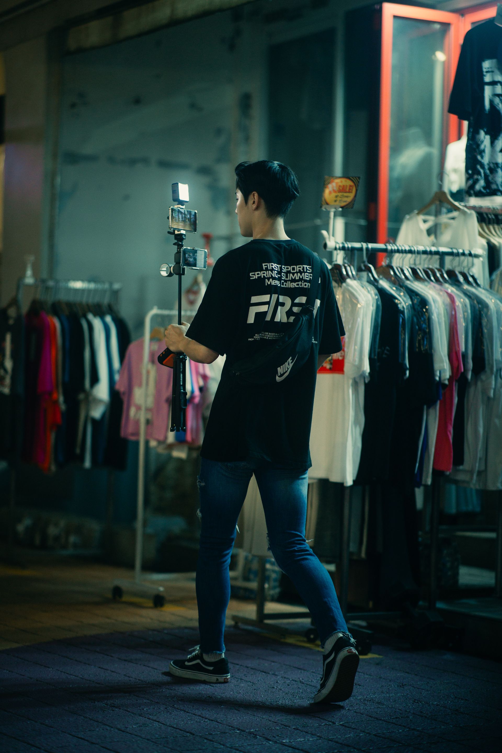 Professional creator filming a fashion brand in a clothing store